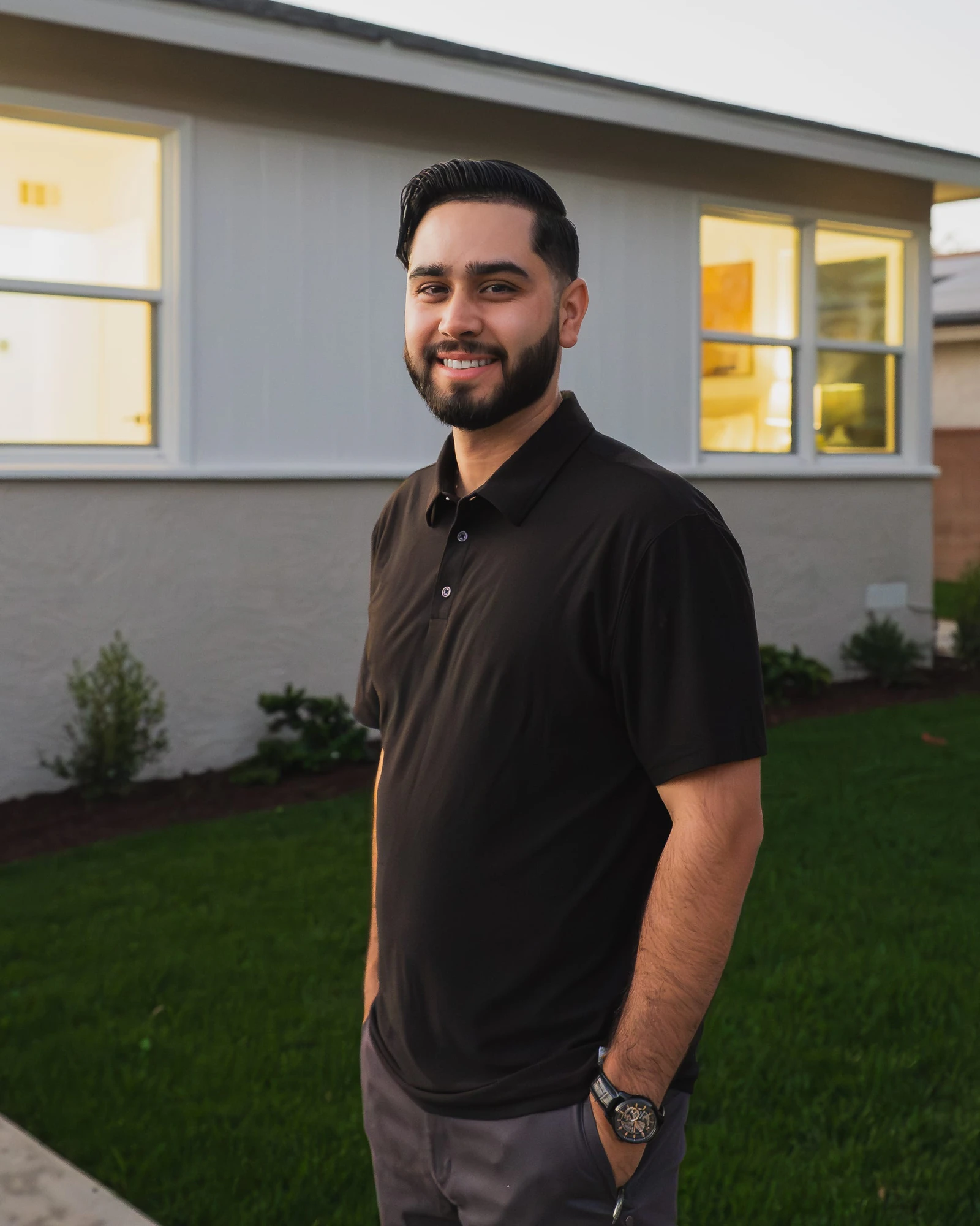 Sal Valencia in front of a finished South Bay project